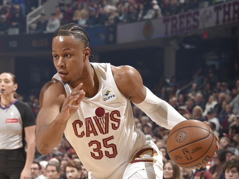 CLEVELAND, OH - FEBRUARY 22: Isaac Okoro #35 of the Cleveland Cavaliers dribbles the ball during the game against the Orlando Magic on February 22, 2024 at Rocket Mortgage FieldHouse in Cleveland, Ohio. NOTE TO USER: User expressly acknowledges and agrees that, by downloading and/or using this Photograph, user is consenting to the terms and conditions of the Getty Images License Agreement. Mandatory Copyright Notice: Copyright 2024 NBAE (Photo by David Liam Kyle/NBAE via Getty Images)