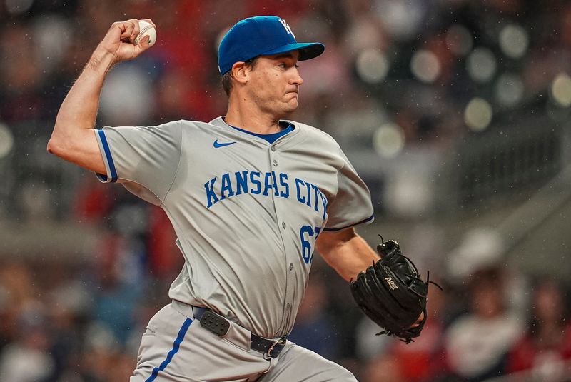 Sep 28, 2024; Cumberland, Georgia, USA; Kansas City Royals starting pitcher Seth Lugo (67) pitches against the Atlanta Braves during the first inning at Truist Park. Mandatory Credit: Dale Zanine-Imagn Images