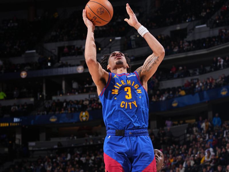 DENVER, CO - NOVEMBER 8: Julian Strawther #3 of the Denver Nuggets drives to the basket during the game against the Miami Heat on November 8, 2024 at Ball Arena in Denver, Colorado. NOTE TO USER: User expressly acknowledges and agrees that, by downloading and/or using this Photograph, user is consenting to the terms and conditions of the Getty Images License Agreement. Mandatory Copyright Notice: Copyright 2024 NBAE (Photo by Bart Young/NBAE via Getty Images)