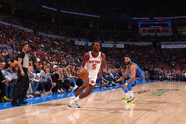 OKLAHOMA CITY, OK - DECEMBER 27: Immanuel Quickley #5 of the New York Knicks dribbles the ball during the game against the Oklahoma City Thunder on December 27, 2023 at Paycom Arena in Oklahoma City, Oklahoma. NOTE TO USER: User expressly acknowledges and agrees that, by downloading and or using this photograph, User is consenting to the terms and conditions of the Getty Images License Agreement. Mandatory Copyright Notice: Copyright 2023 NBAE (Photo by Zach Beeker/NBAE via Getty Images)