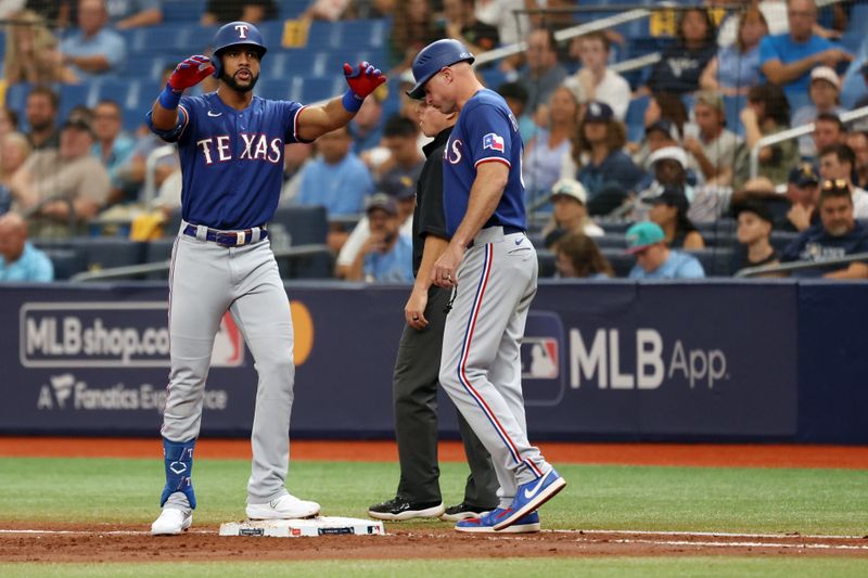 Oct 3, 2023; St. Petersburg, Florida, USA; Texas Rangers center fielder Leody Taveras (3) reacts after his single against the Tampa Bay Rays in the second inning during game one of the Wildcard series for the 2023 MLB playoffs at Tropicana Field. Mandatory Credit: Kim Klement Neitzel-USA TODAY Sports