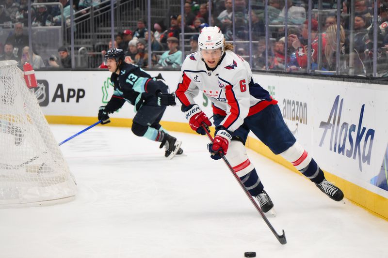 Jan 23, 2025; Seattle, Washington, USA; Washington Capitals defenseman Jakob Chychrun (6) plays the puck during the third period against the Seattle Kraken at Climate Pledge Arena. Mandatory Credit: Steven Bisig-Imagn Images