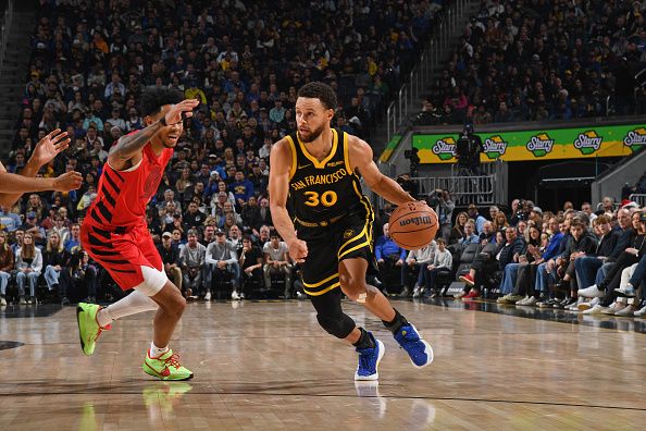 SAN FRANCISCO, CA - DECEMBER 23: Stephen Curry #30 of the Golden State Warriors drives to the basket during the game against the Portland Trail Blazers on December 23, 2023 at Chase Center in San Francisco, California. NOTE TO USER: User expressly acknowledges and agrees that, by downloading and or using this photograph, user is consenting to the terms and conditions of Getty Images License Agreement. Mandatory Copyright Notice: Copyright 2023 NBAE (Photo by Noah Graham/NBAE via Getty Images)