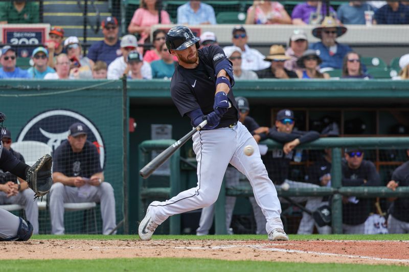 Mar 23, 2024; Lakeland, Florida, USA; Detroit Tigers catcher Carson Kelly (15) hits a two run home run during the third inning against the New York Yankees at Publix Field at Joker Marchant Stadium. Mandatory Credit: Mike Watters-USA TODAY Sports