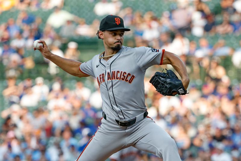 Jun 17, 2024; Chicago, Illinois, USA; San Francisco Giants starting pitcher Jordan Hicks (12) delivers a pitch against the Chicago Cubs during the first inning at Wrigley Field. Mandatory Credit: Kamil Krzaczynski-USA TODAY Sports