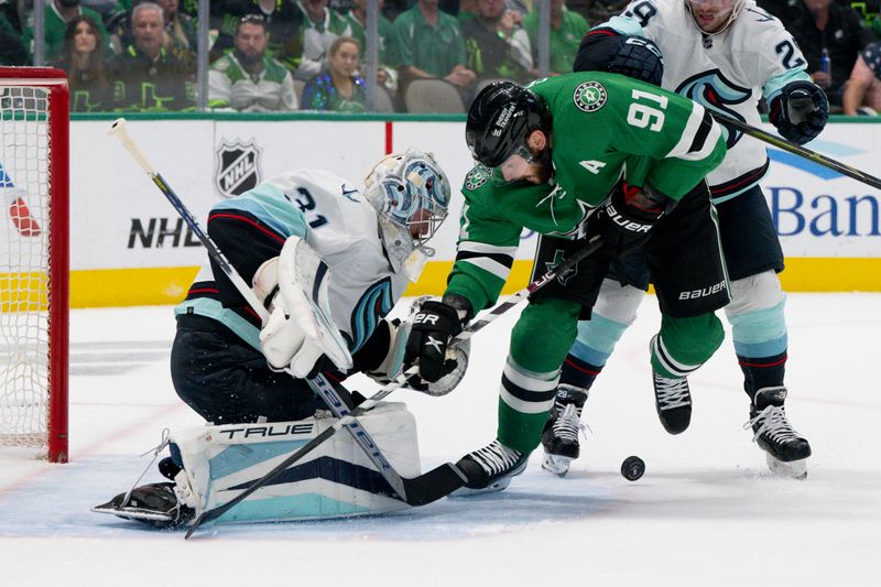 May 15, 2023; Dallas, Texas, USA; Dallas Stars center Tyler Seguin (91) attempts to poke the puck past Seattle Kraken goaltender Philipp Grubauer (31) during the second period in game seven of the second round of the 2023 Stanley Cup Playoffs at the American Airlines Center. Mandatory Credit: Jerome Miron-USA TODAY Sports