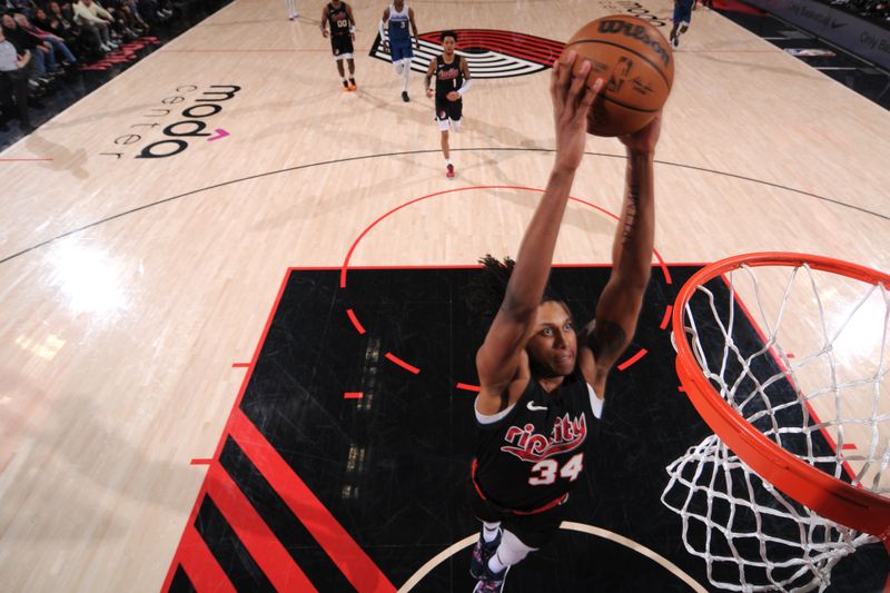 PORTLAND, OR - FEBRUARY 15: Jabari Walker #34 of the Portland Trail Blazers dunks the ball during the game against the Minnesota Timberwolves on February 15, 2024 at the Moda Center Arena in Portland, Oregon. NOTE TO USER: User expressly acknowledges and agrees that, by downloading and or using this photograph, user is consenting to the terms and conditions of the Getty Images License Agreement. Mandatory Copyright Notice: Copyright 2024 NBAE (Photo by Cameron Browne/NBAE via Getty Images)