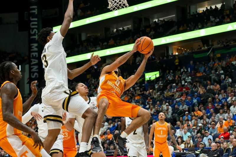 Mar 13, 2026; Nashville, TN, USA;  Tennessee Volunteers guard Ja’Kobi Gillespie (0) shoots overVanderbilt Commodores forward Jalen Washington (13) during the second half at Bridgestone Arena. Mandatory Credit: Steve Roberts-Imagn Images