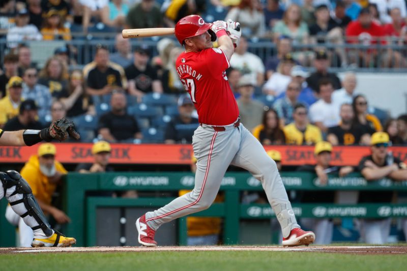 Aug 23, 2024; Pittsburgh, Pennsylvania, USA;  Cincinnati Reds catcher Tyler Stephenson (37) hits a solo home run against the Pittsburgh Pirates during the first inning at PNC Park. Mandatory Credit: Charles LeClaire-USA TODAY Sports