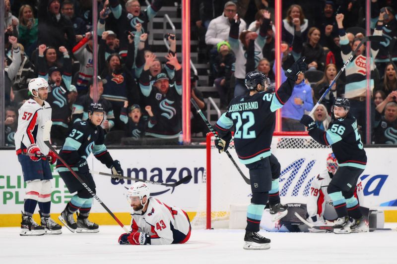 Mar 14, 2024; Seattle, Washington, USA; Seattle Kraken right wing Oliver Bjorkstrand (22) celebrates after scoring a goal against the Washington Capitals during the third period at Climate Pledge Arena. Mandatory Credit: Steven Bisig-USA TODAY Sports