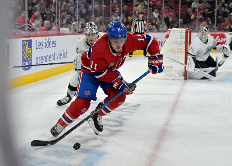 Dec 7, 2023; Montreal, Quebec, CAN; Montreal Canadiens forward Brendan Gallagher (11) plays the puck and Los Angeles Kings forward Alex Laferriere (78) defends during the second period at the Bell Centre. Mandatory Credit: Eric Bolte-USA TODAY Sports