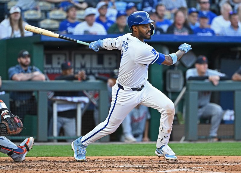 May 21, 2024; Kansas City, Missouri, USA;  Kansas City Royals third baseman Maikel Garcia (11) hits an RBI triple in the third inning against the Detroit Tigers at Kauffman Stadium. Mandatory Credit: Peter Aiken-USA TODAY Sports