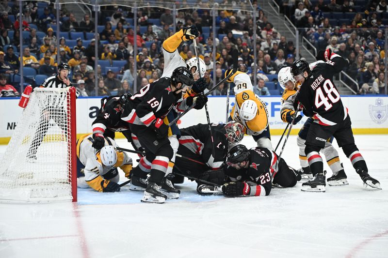 Jan 31, 2025; Buffalo, New York, USA; Buffalo Sabres goaltender Ukko-Pekka Luukkonen (1) covers the puck with a number of other players around the net in the third period of a game against the Nashville Predators at the KeyBank Center. Mandatory Credit: Mark Konezny-Imagn Images