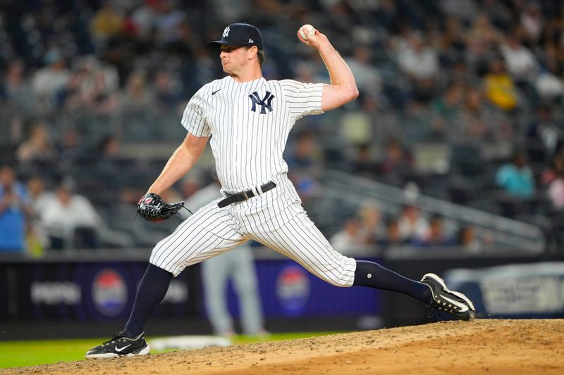 Sep 7, 2023; Bronx, New York, USA; New York Yankees pitcher Michael Krook (92) delivers a pitch against the Detroit Tigers during the ninth inning at Yankee Stadium. Mandatory Credit: Gregory Fisher-USA TODAY Sports