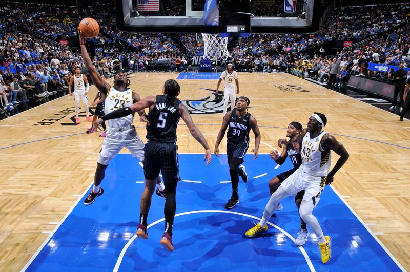 ORLANDO, FL - OCTOBER 28: Aaron Nesmith #23 of the Indiana Pacers drives to the basket during the game against the Orlando Magic on October 28, 2024 at Kia Center in Orlando, Florida. NOTE TO USER: User expressly acknowledges and agrees that, by downloading and or using this photograph, User is consenting to the terms and conditions of the Getty Images License Agreement. Mandatory Copyright Notice: Copyright 2024 NBAE (Photo by Fernando Medina/NBAE via Getty Images)