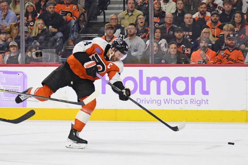 Nov 25, 2024; Philadelphia, Pennsylvania, USA; Philadelphia Flyers center Sean Couturier (14) scores a goal against the Vegas Golden Knights during the first period at Wells Fargo Center. Mandatory Credit: Eric Hartline-Imagn Images