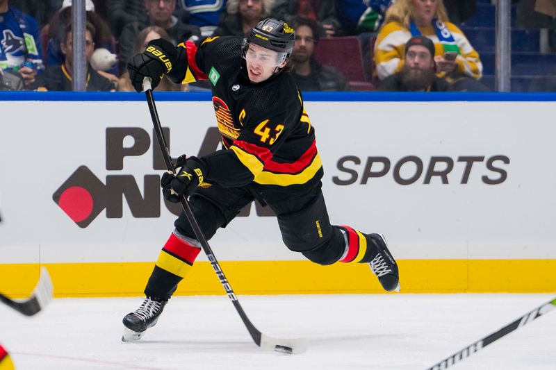 Dec 23, 2023; Vancouver, British Columbia, CAN; Vancouver Canucks defenseman Quinn Hughes (43) shoots against the San Jose Sharks in the third period at Rogers Arena. Canucks won 7-4. Mandatory Credit: Bob Frid-USA TODAY Sports