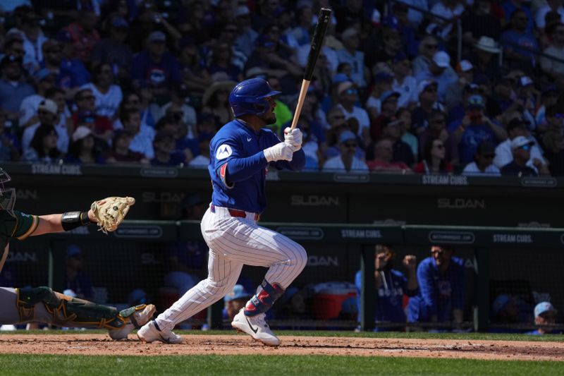Mar 7, 2026; Mesa, Arizona, USA; Chicago Cubs second baseman Pedro Ramirez (75) hits a solo home run against the Athletics in the second inning at Sloan Park. Mandatory Credit: Rick Scuteri-Imagn Images