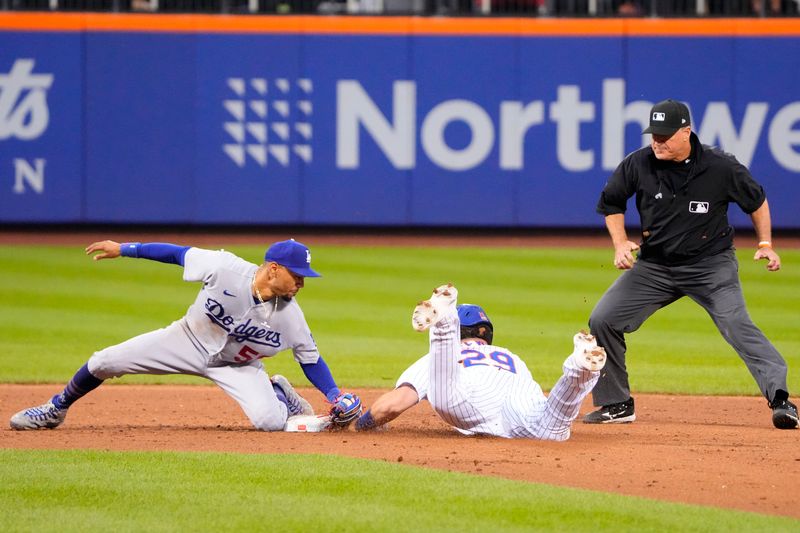 Jul 16, 2023; New York City, New York, USA; New York Mets right fielder DJ Steward (29) steals second base ahead of the tag by Los Angeles Dodgers second baseman Mookie Betts (50) during the ninth inning at Citi Field. Mandatory Credit: Gregory Fisher-USA TODAY Sports