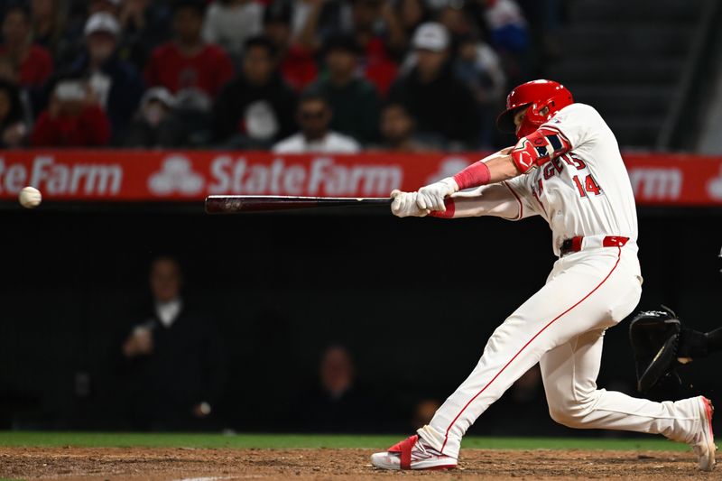 May 11, 2024; Anaheim, California, USA; Los Angeles Angels catcher Logan O'Hoppe (14) hits a two run double against the Kansas City Royals during the seventh inning at Angel Stadium. Mandatory Credit: Jonathan Hui-USA TODAY Sports