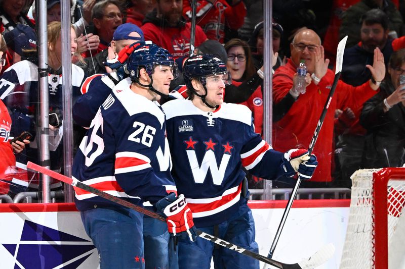 Dec 30, 2023; Washington, District of Columbia, USA; Washington Capitals left wing Beck Malenstyn (47) is congratulated by right wing Nic Dowd (26) after scoring a goal against the Nashville Predators during the first period at Capital One Arena. Mandatory Credit: Brad Mills-USA TODAY Sports