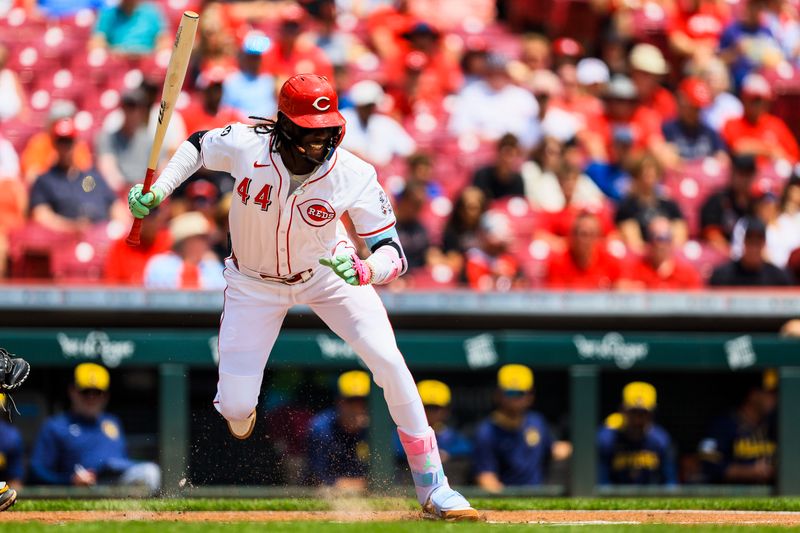 Jun 4, 2025; Cincinnati, Ohio, USA; Cincinnati Reds shortstop Elly De La Cruz (44) dodges a wild pitch in the first inning against the Milwaukee Brewers at Great American Ball Park. Mandatory Credit: Katie Stratman-Imagn Images