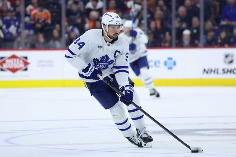 Jan 8, 2026; Philadelphia, Pennsylvania, USA; Toronto Maple Leafs center Auston Matthews (34) skates with the puck against the Philadelphia Flyers during overtime at Xfinity Mobile Arena. Mandatory Credit: Bill Streicher-Imagn Images