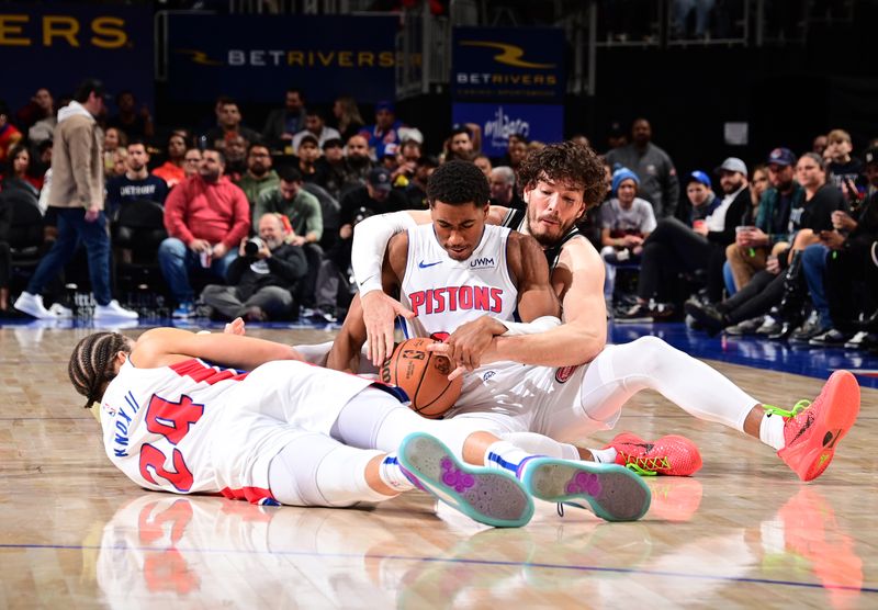 DETROIT, MI - JANUARY 10: Jaden Ivey #23 of the Detroit Pistons and Cedi Osman #16 of the San Antonio Spurs battle for the ball on January 10, 2024 at Little Caesars Arena in Detroit, Michigan. NOTE TO USER: User expressly acknowledges and agrees that, by downloading and/or using this photograph, User is consenting to the terms and conditions of the Getty Images License Agreement. Mandatory Copyright Notice: Copyright 2024 NBAE (Photo by Chris Schwegler/NBAE via Getty Images)