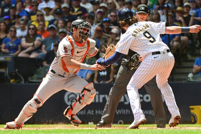 May 28, 2023; Milwaukee, Wisconsin, USA; San Francisco Giants catcher Blake Sabol (2) tags out Milwaukee Brewers third baseman Brian Anderson (9) in the first inning at American Family Field. Mandatory Credit: Benny Sieu-USA TODAY Sports