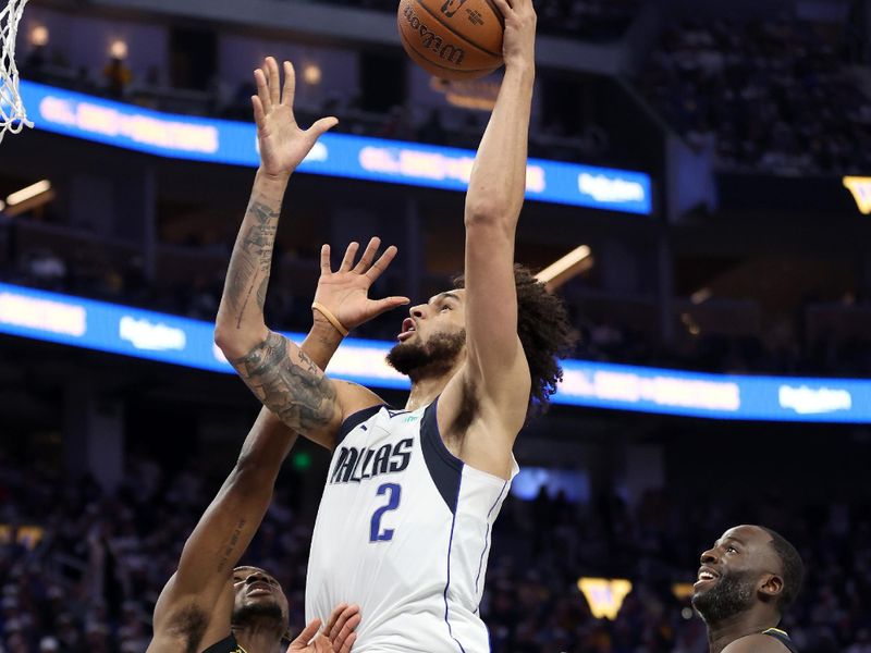 SAN FRANCISCO, CALIFORNIA - NOVEMBER 12: Dereck Lively II #2 of the Dallas Mavericks shoots over Jonathan Kuminga #00 of the Golden State Warriors at Chase Center on November 12, 2024 in San Francisco, California. NOTE TO USER: User expressly acknowledges and agrees that, by downloading and/or using this photograph, user is consenting to the terms and conditions of the Getty Images License Agreement.  (Photo by Ezra Shaw/Getty Images)