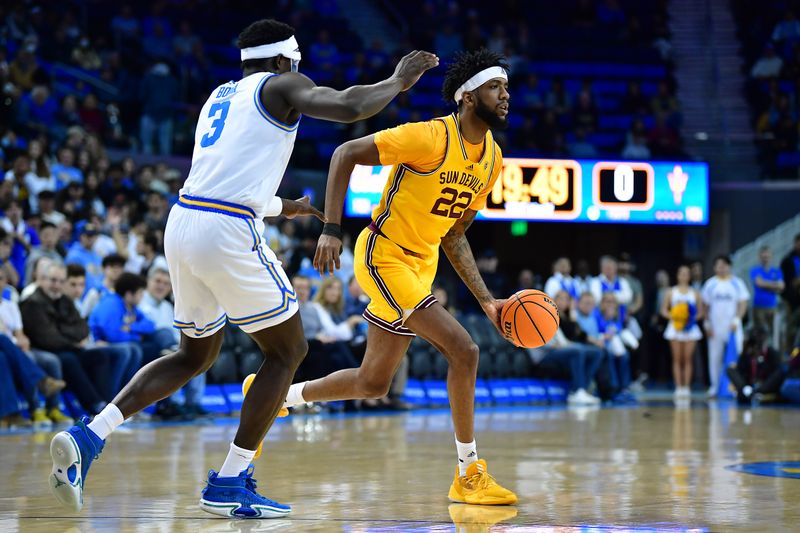 Mar 2, 2023; Los Angeles, California, USA; Arizona State Sun Devils forward Warren Washington (22) moves the ball against UCLA Bruins forward Adem Bona (3) during the first half at Pauley Pavilion. Mandatory Credit: Gary A. Vasquez-USA TODAY Sports