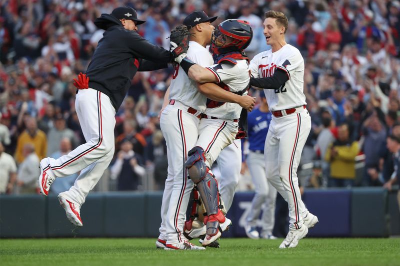 Oct 4, 2023; Minneapolis, Minnesota, USA; Minnesota Twins relief pitcher Jhoan Duran (59) celebrates with team mates after defeating Toronto Blue Jays during game two of the Wildcard series for the 2023 MLB playoffs at Target Field. Mandatory Credit: Jesse Johnson-USA TODAY Sports