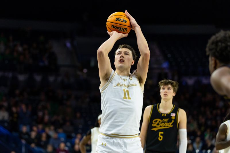 Dec 21, 2025; South Bend, Indiana, USA; Purdue Fort Wayne Mastodons forward Maximus Nelson (11) makes free throws in the final seconds of the game against the Notre Dame Fighting Irish during the second half at Purcell Pavilion at the Joyce Center. Mandatory Credit: Michael Caterina-Imagn Images