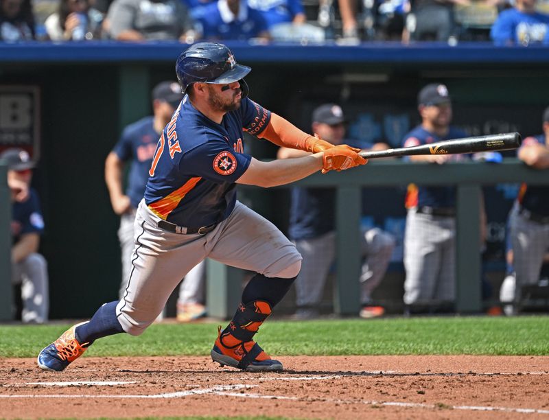 Sep 17, 2023; Kansas City, Missouri, USA; Houston Astros right fielder Chas McCormick (20) singles in a run in the third inning against the Kansas City Royals at Kauffman Stadium. Mandatory Credit: Peter Aiken-USA TODAY Sports