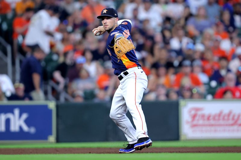 Aug 13, 2023; Houston, Texas, USA; Houston Astros third baseman Alex Bregman (2) throws a fielded ball to first base for an out against the Los Angeles Angels during the fourth inning at Minute Maid Park. Mandatory Credit: Erik Williams-USA TODAY Sports