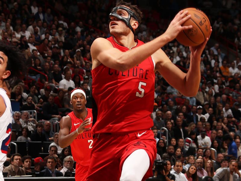 MIAMI, FL - NOVEMBER 18: Nikola Jovic #5 of the Miami Heat drives to the basket during the game against the Philadelphia 76ers on November 18, 2024 at Kaseya Center in Miami, Florida. NOTE TO USER: User expressly acknowledges and agrees that, by downloading and or using this Photograph, user is consenting to the terms and conditions of the Getty Images License Agreement. Mandatory Copyright Notice: Copyright 2024 NBAE (Photo by Issac Baldizon/NBAE via Getty Images)