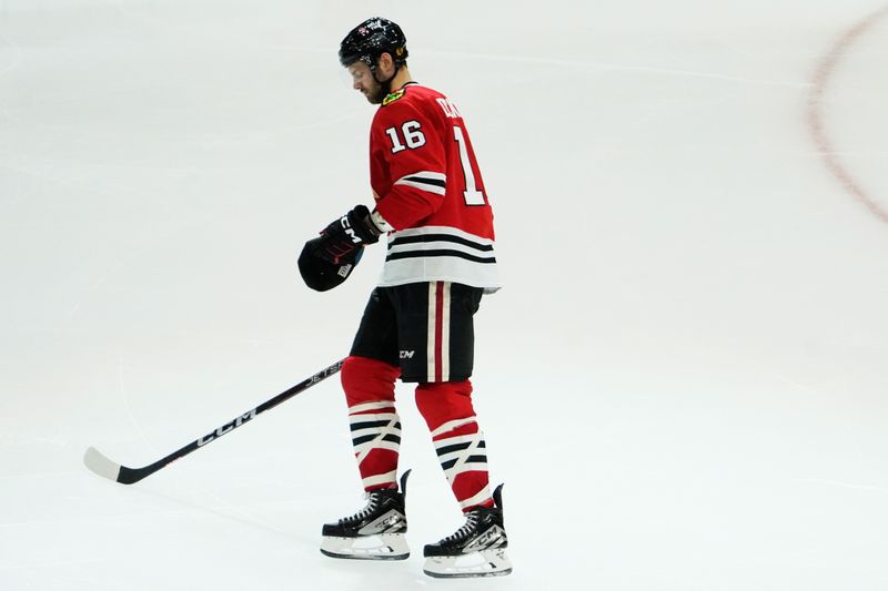 Nov 24, 2023; Chicago, Illinois, USA; Chicago Blackhawks center Jason Dickinson (16) celebrates his hat trick against the Toronto Maple Leafs during the third period at United Center. Mandatory Credit: David Banks-USA TODAY Sports