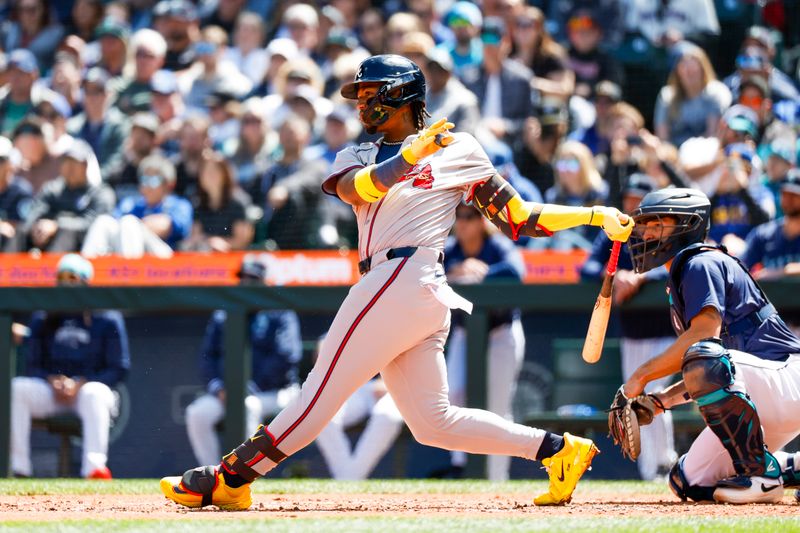 May 1, 2024; Seattle, Washington, USA; Atlanta Braves right fielder Ronald Acuna Jr. (13) hits an RBI-single against the Seattle Mariners during the fourth inning at T-Mobile Park. Mandatory Credit: Joe Nicholson-USA TODAY Sports