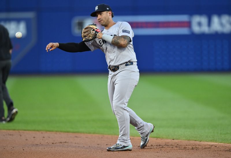 Aug 18, 2024; Williamsport, Pennsylvania, USA; New York Yankees infielder Gleyber Torres (25) throws to first against the Detroit Tigers in the second inning at BB&T Ballpark at Historic Bowman Field. Mandatory Credit: Kyle Ross-USA TODAY Sports