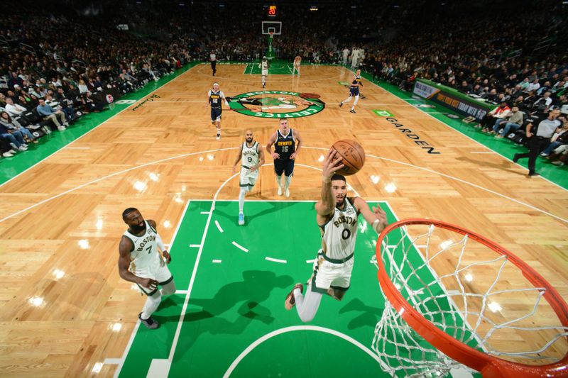 BOSTON, MA - JANUARY 19:  Jayson Tatum #0 of the Boston Celtics drives to the basket during the game against the Denver Nuggets on January 19, 2024 at the TD Garden in Boston, Massachusetts. NOTE TO USER: User expressly acknowledges and agrees that, by downloading and or using this photograph, User is consenting to the terms and conditions of the Getty Images License Agreement. Mandatory Copyright Notice: Copyright 2024 NBAE  (Photo by Brian Babineau/NBAE via Getty Images)