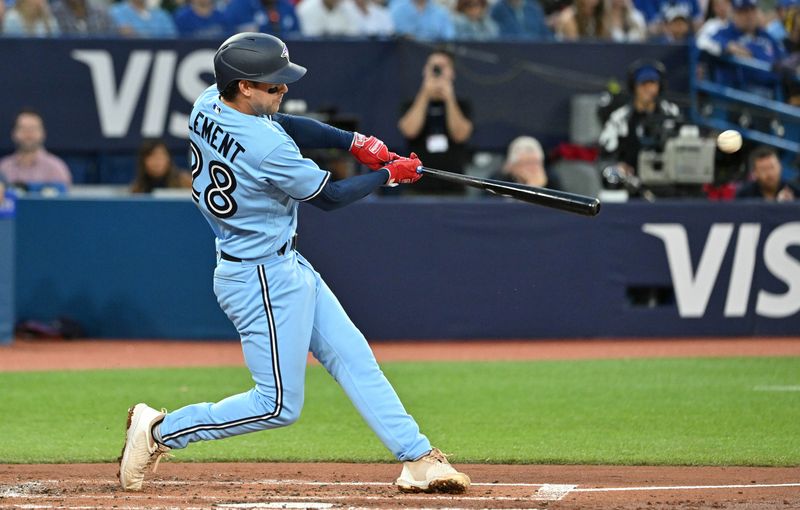 Aug 28, 2023; Toronto, Ontario, CAN;  Toronto Blue Jays shortstop Ernie Clement (28) singles against the Washington Nationals in the third inning at Rogers Centre. Mandatory Credit: Dan Hamilton-USA TODAY Sports