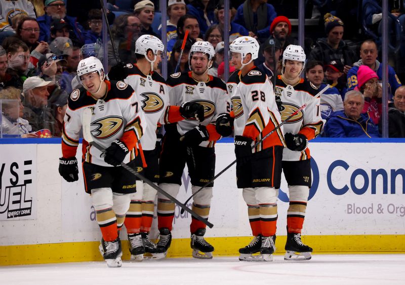 Feb 19, 2024; Buffalo, New York, USA;  Anaheim Ducks right wing Frank Vatrano (77) celebrates his second goal of the game with teammates during the second period against the Buffalo Sabres at KeyBank Center. Mandatory Credit: Timothy T. Ludwig-USA TODAY Sports