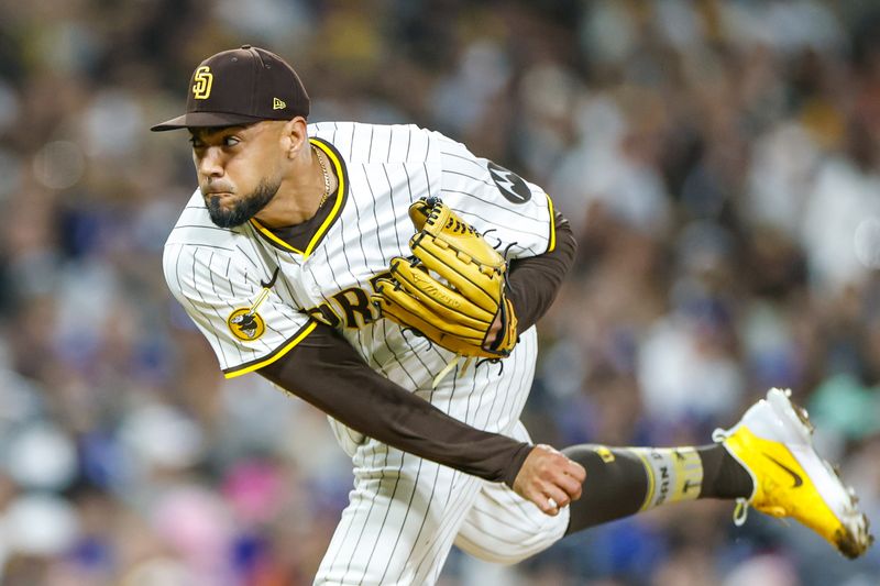 Jun 9, 2025; San Diego, California, USA; San Diego Padres relief pitcher Robert Suarez (75) throws a pitch during the ninth inning against the Los Angeles Dodgers at Petco Park. Mandatory Credit: David Frerker-Imagn Images