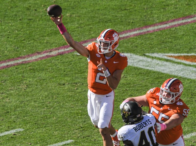 Oct 7, 2023; Clemson, South Carolina, USA; Clemson quarterback Cade Klubnik (2) passes near Wake Forest defensive end Jacorey Johns during the first quarter at Memorial Stadium. Mandatory Credit: Ken Ruinard-USA TODAY Sports