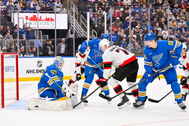 Nov 28, 2025; St. Louis, Missouri, USA; St. Louis Blues goaltender Jordan Binnington (50) defends the net against Ottawa Senators left wing Brady Tkachuk (7) during the third period at Enterprise Center. Mandatory Credit: Jeff Curry-Imagn Images