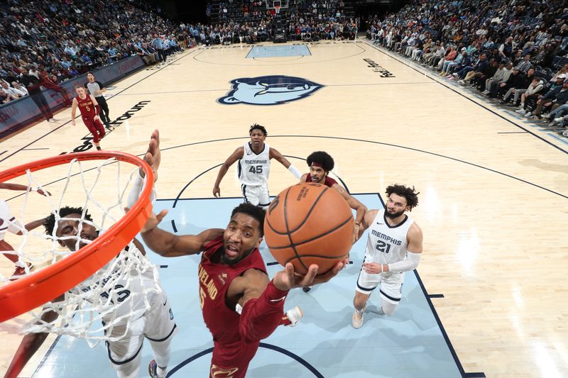 MEMPHIS, TN - FEBRUARY 1:  Donovan Mitchell #45 of the Cleveland Cavaliers drives to the basket during the game  against the Memphis Grizzlies on February 1, 2024 at FedExForum in Memphis, Tennessee. NOTE TO USER: User expressly acknowledges and agrees that, by downloading and or using this photograph, User is consenting to the terms and conditions of the Getty Images License Agreement. Mandatory Copyright Notice: Copyright 2024 NBAE (Photo by Joe Murphy/NBAE via Getty Images)
