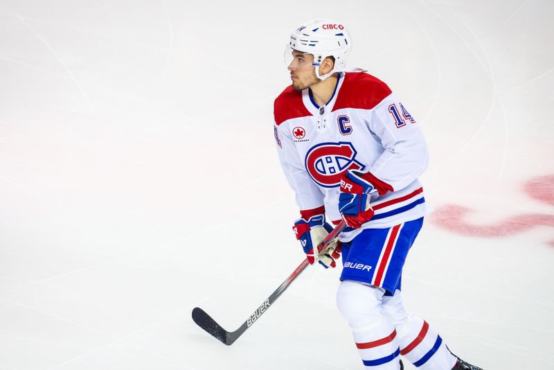 Mar 16, 2024; Calgary, Alberta, CAN; Montreal Canadiens center Nick Suzuki (14) skates during the warmup period against the Calgary Flames at Scotiabank Saddledome. Mandatory Credit: Sergei Belski-USA TODAY Sports