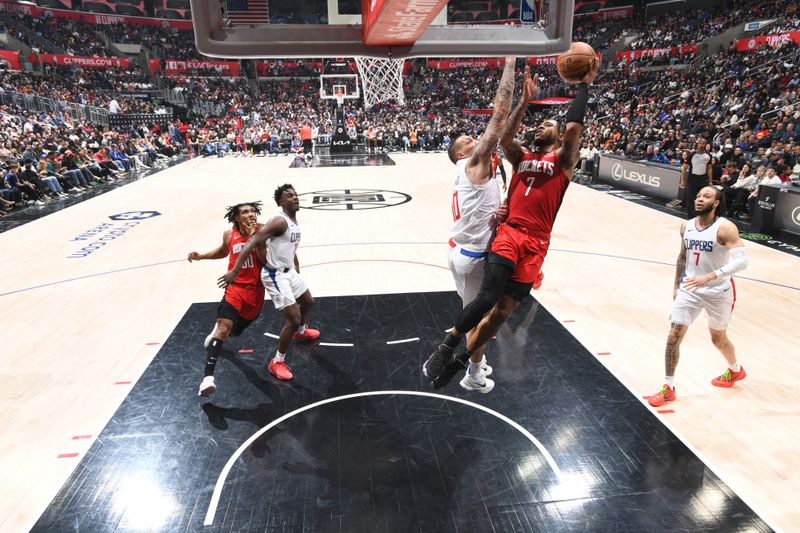 LOS ANGELES, CA - APIRL 14: Cam Whitmore #7 of the Houston Rockets drives to the basket during the game against the LA Clippers on April 14, 2024 at Crypto.Com Arena in Los Angeles, California. NOTE TO USER: User expressly acknowledges and agrees that, by downloading and/or using this Photograph, user is consenting to the terms and conditions of the Getty Images License Agreement. Mandatory Copyright Notice: Copyright 2024 NBAE (Photo by Adam Pantozzi/NBAE via Getty Images)