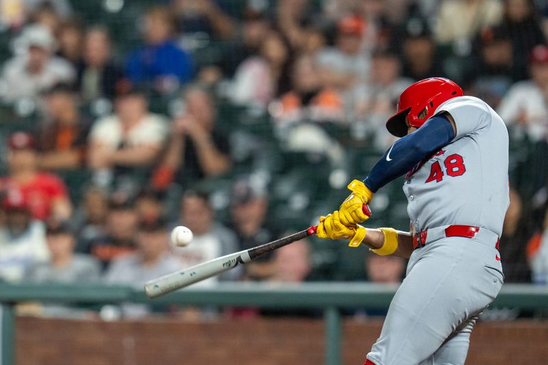 Sep 24, 2025; San Francisco, California, USA; St. Louis Cardinals designated hitter Iván Herrera (48) hits an RBI single against the San Francisco Giants during the third inning at Oracle Park. Mandatory Credit: Neville E. Guard-Imagn Images