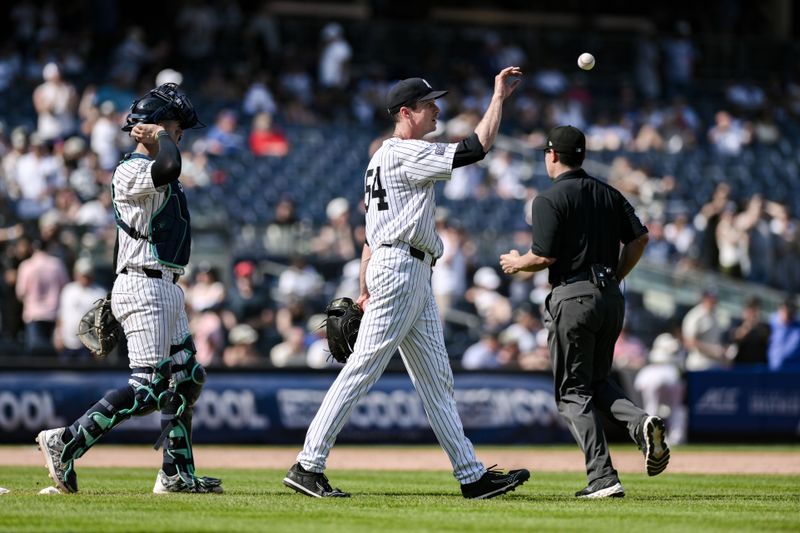 Aug 10, 2024; Bronx, New York, USA; New York Yankees pitcher Tim Hill (54) reacts after getting the games final out against the Texas Rangers at Yankee Stadium. Mandatory Credit: John Jones-USA TODAY Sports